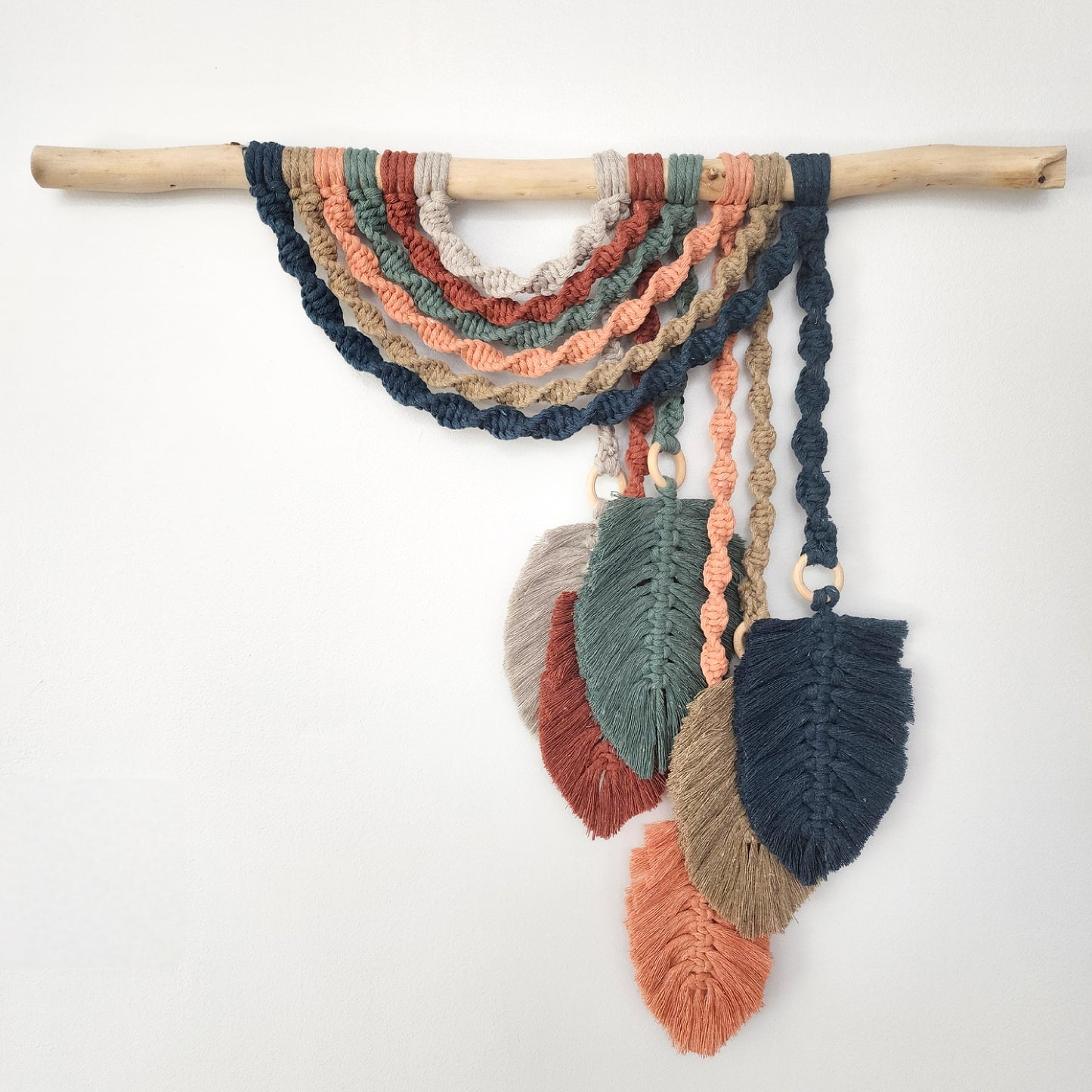 Boho wall hanging with green leaves