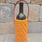 Handmade crochet wine bag carrier with leather handle – eco-friendly gift for wine lovers.