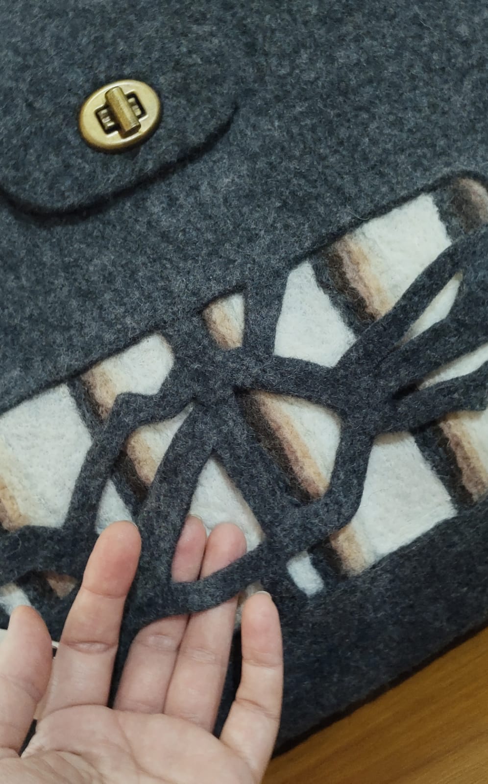 Interior view of handmade felt handbag showing soft Merino wool and minimalist Patagonia Chalten design.