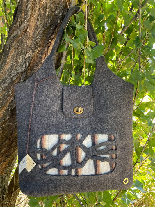 Handcrafted felt handbag made from Merino wool in Patagonia, Chalten – sustainable and elegant handmade bag.