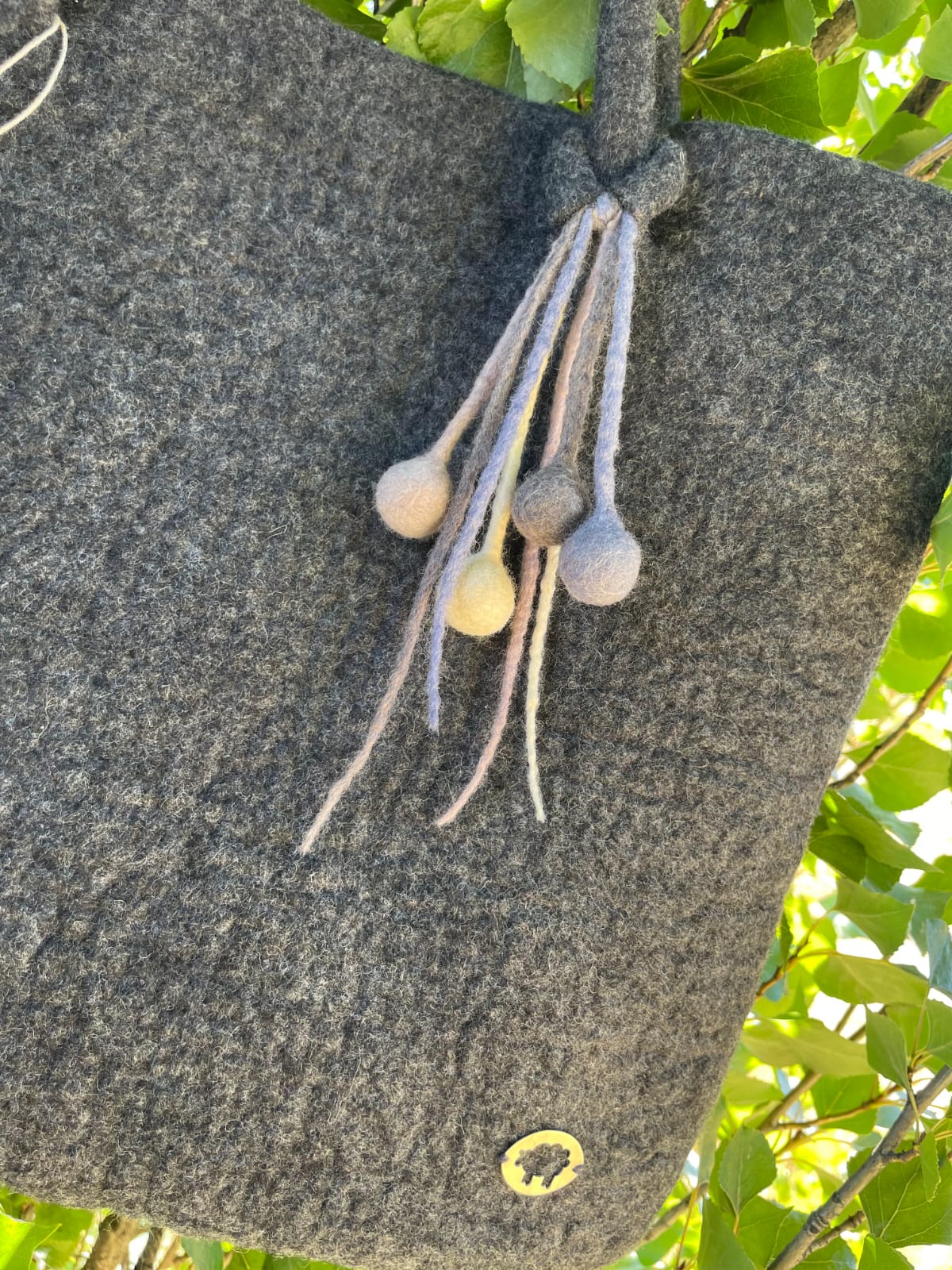 Handcrafted felt handbag made from Merino wool in Patagonia – sustainable and elegant handmade bag.