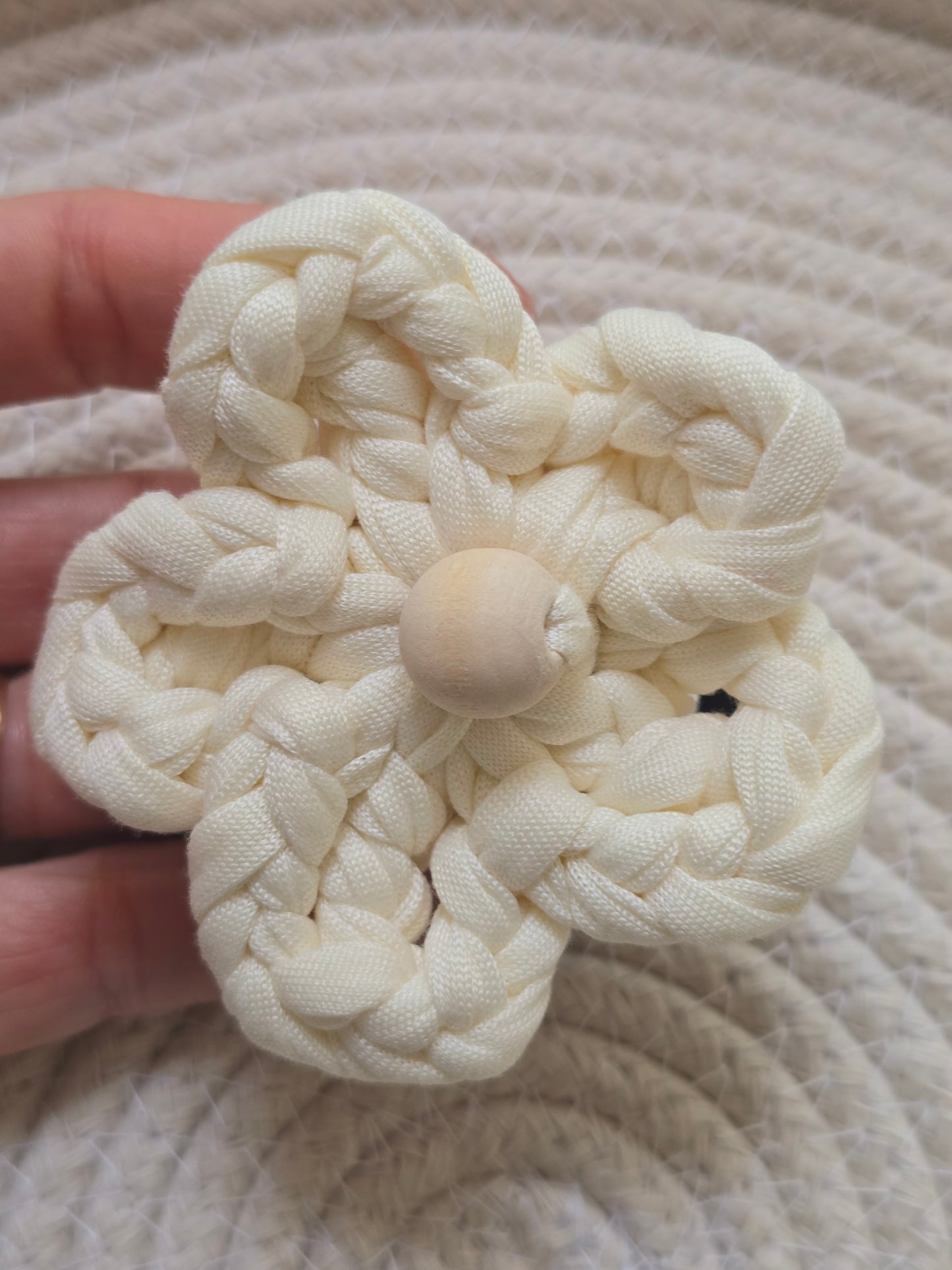 Close-up of handmade cotton floral hair accessory