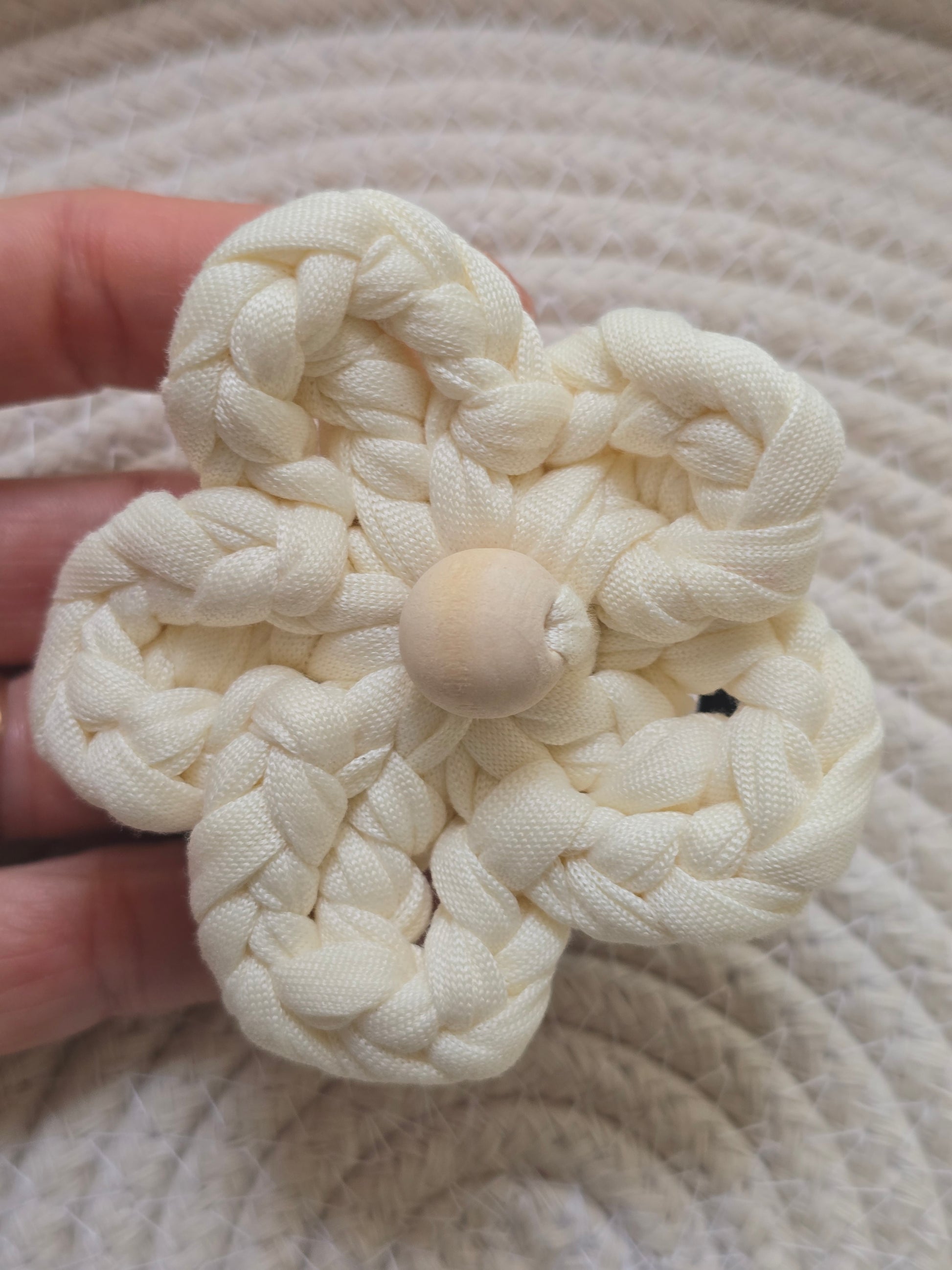 Close-up of handmade cotton floral hair accessory
